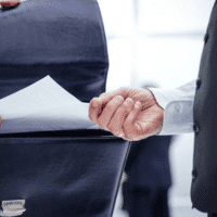 A man hands over documents