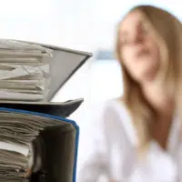 Close-up of thick folders in an office representing what is a process server work
