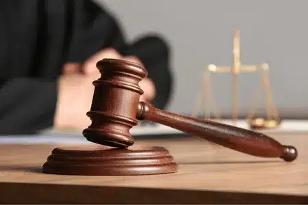 Judge’s gavel on courtroom desk raises question—how much does a court reporter cost?