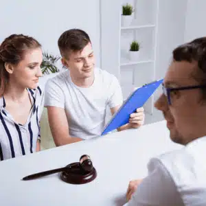 Couple reviews medical documents with attorney to support retrieval of medical record in court