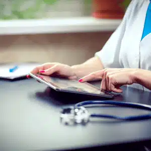 Clinician using tablet emphasizes common problems associated with medical records during transitions
