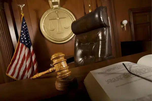 court reporter Houston courtroom image showing judge bench, gavel, American flag, and legal documents ready